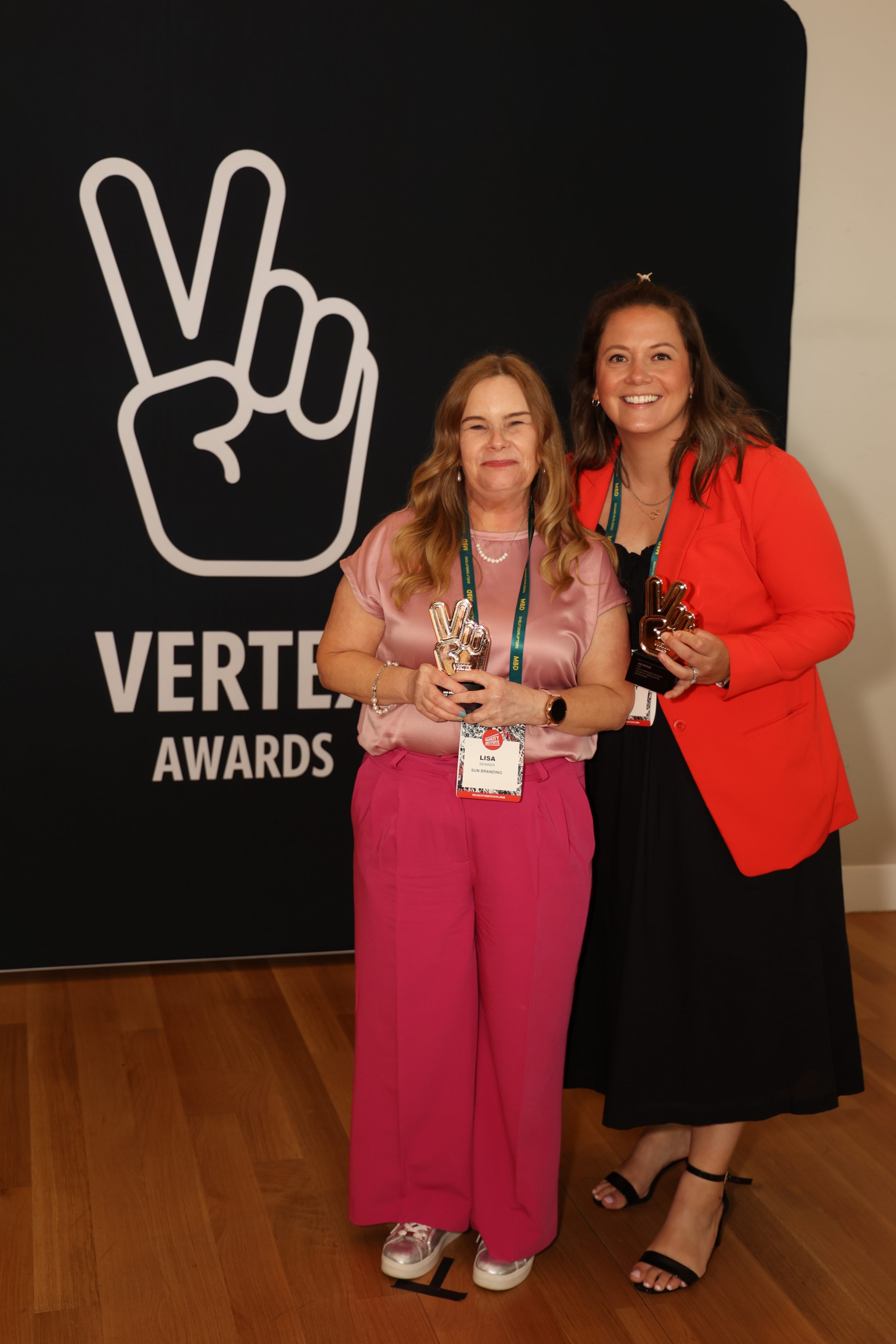 Lisa from Sun Branding with Kristy from Aldi USA, collecting Vertex award